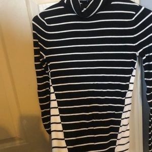 The limited striped black and white turtleneck